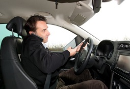 A man is distracted while driving