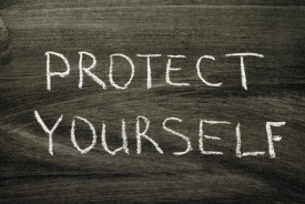 Protect yourself phrase handwritten on school blackboard