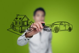Man drawing a house and car