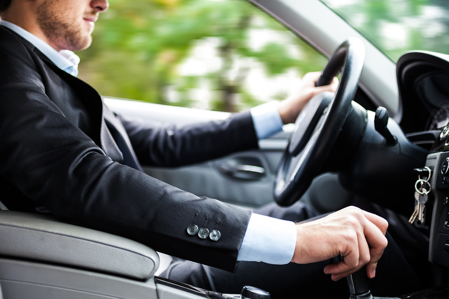 bigstock-Man-driving-his-car-38741989