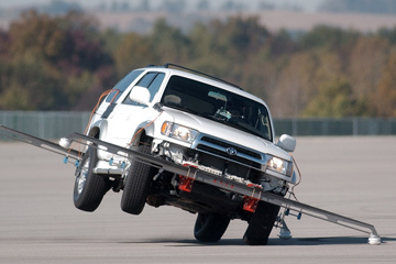 A 2000 Toyota 4Runner lifts its passenger-side wheels while taking part in a dynamic rollover test conducted by the NHTSA at the Transportation Research Center in East Liberty, Ohio.
