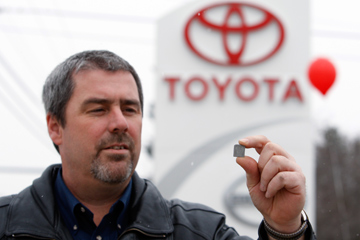 Image Gallery: Car Safety Dan Daigle, service manager at Lee Toyota in Topsham, Maine, holds a shim that will be used to repair springs in the gas pedal systems of recalled Toyota automobiles. See more car safety pictures.