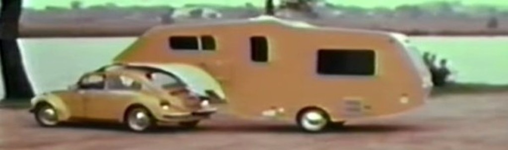 Vintage 5th Wheel Travel Trailer Towed by a VW Bug