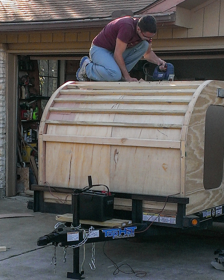 Cutting-a-hole-in-the-roof-for-the-vent-fan