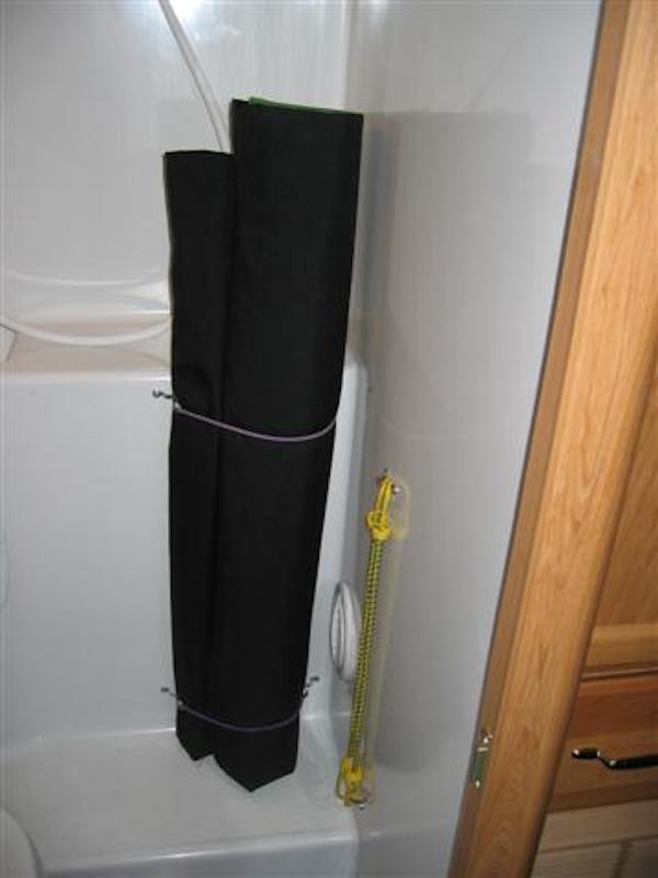 Pad-eyes-and-bungee-cords-in-the-RV-shower