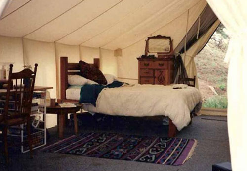 wood and canvas tent simple bedroom