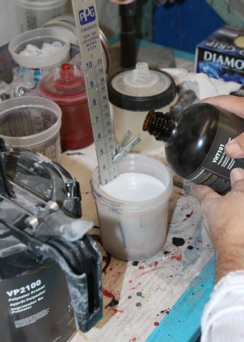 Mixing Stick Clamped To Container