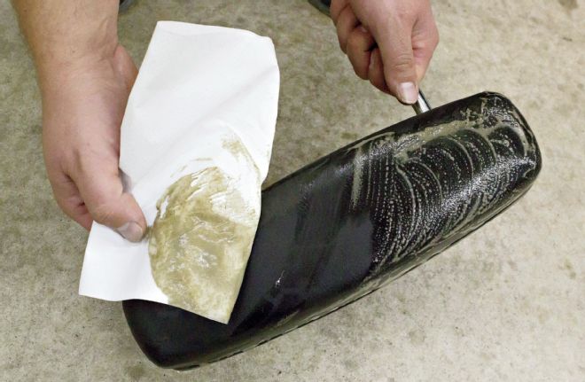 Headrest Wiping Soapy Water Off Vinyl With Paper Towel