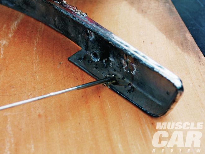 1965 Plymouth Barracuda Hood Emblem Cut Section Laying Rod On Crack
