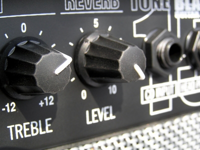 How to Increase Bass Output on a Speaker Using a Capacitor in a Series With a Speaker