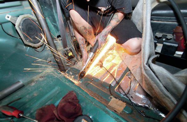 Another set of holes are cut into the floorpan, this time for the struts just aft of the front seats. These were left till after most of the ’cage was in to determine proper location in regards to the rear seats.