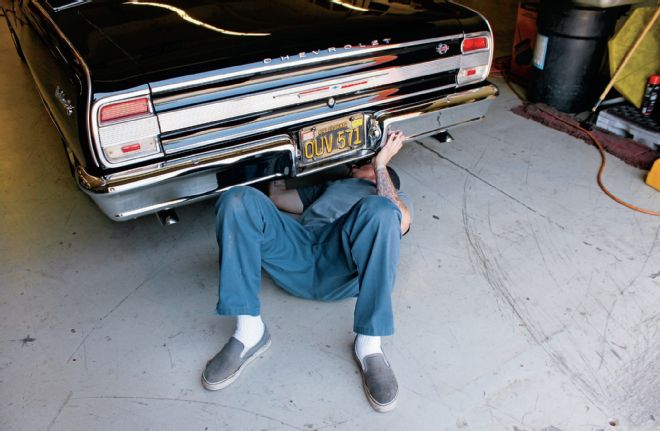 1964 Chevrolet Malibu Adjusting Shocks From Under The Car
