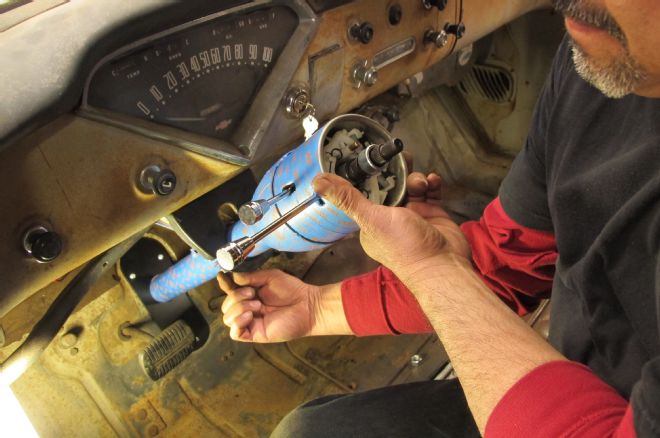 1955 Chevrolet 3100 Plain Stainless Column Being Bolted Upright