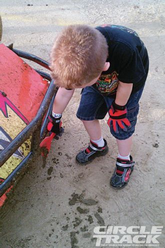 Landon King Scarping Off Mud