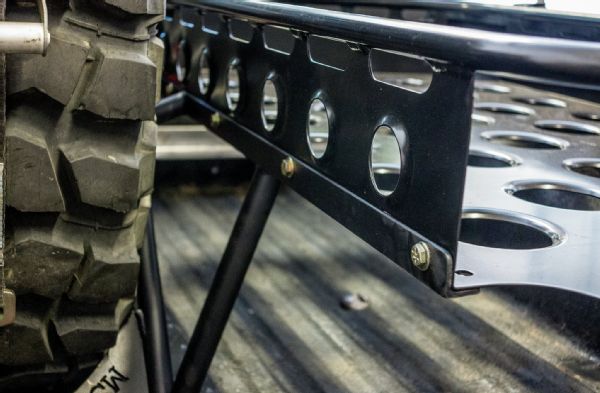 The spare tire mount was built out of 1-inch tubing and acted as the foundation for the rail that holds the Baja Basket on the driver side. Note that the basket bolts into the mount and can easily be removed if necessary.