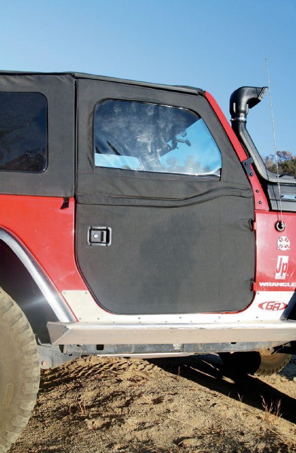 The last thing we did was to put these two-piece soft doors on it. Those goofy full hard doors are heavy, not to mention expensive to replace. So, we ran all summer with these on (or in the back of) the Jeep. We had problems with the tops of the doors pulling out around 80 mph, so if you live where there are higher speed limits and it rains, you might want to keep that in mind. But, if you use your Jeep like a Jeep is supposed to be used, as we do, you probably won’t care. The doors include locks, which many find funny on a soft top-equipped Jeep, but we like the locks. Like the old saying goes, “it keeps honest people honest.”