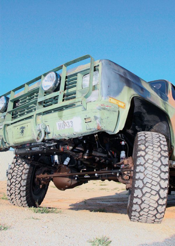 <strong>1.</strong> Our old army truck bumper was built back in 2005, and you can see how that winch was tucked up behind the factory bumper. This design is great in that it helps the approach angle and keeps the truck shorter overall. The problem is it makes it hard to access the free-spool lever, especially if the truck is buried to the frame in mud.