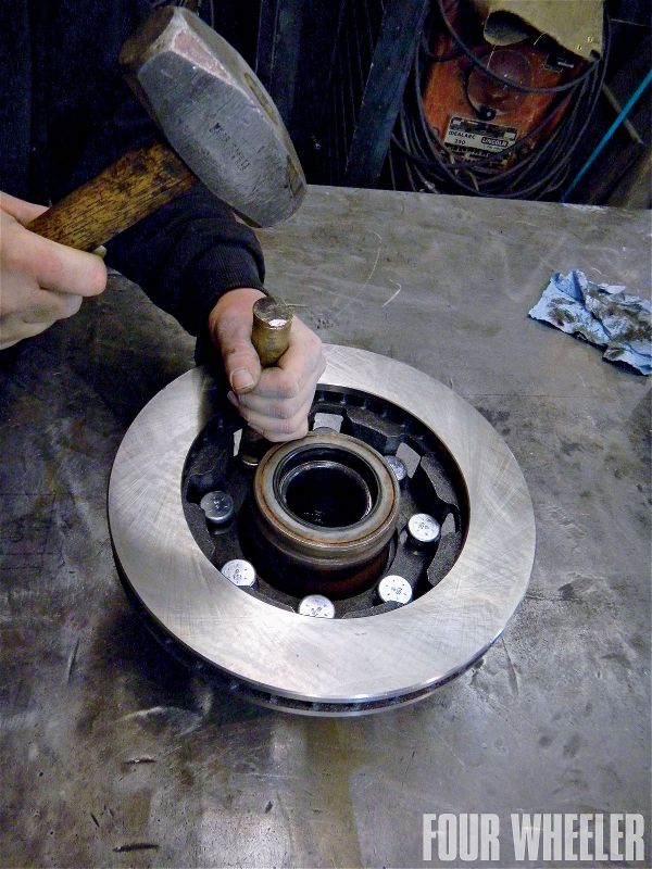 Using a hammer and a soft drift, the new studs were installed into the hub assembly along with the new rotors as shown.