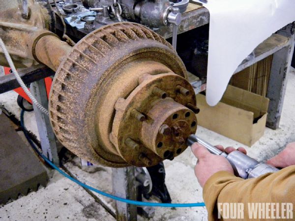 The first step in the installation process is removal of the factory drum brake setup. To do this, the full-floater axleshafts must be removed from the housing.