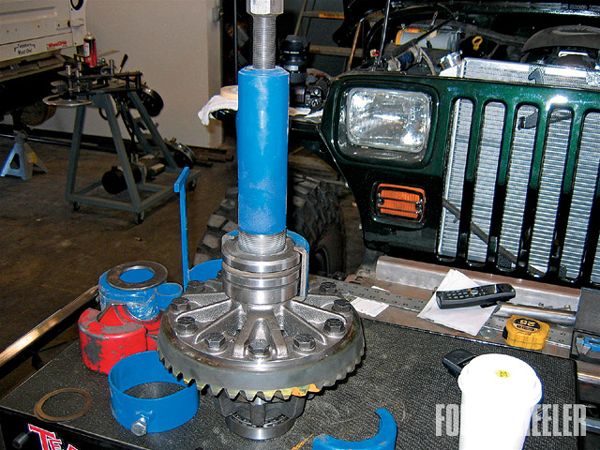 10. The tedious part of setting up a brand-new locker in a Dana 70 rear differential is setting the proper shim spacing on either side of the main bearings. The process requires that you install and remove the bearings by pressing several times until the proper shim spacing is attained.