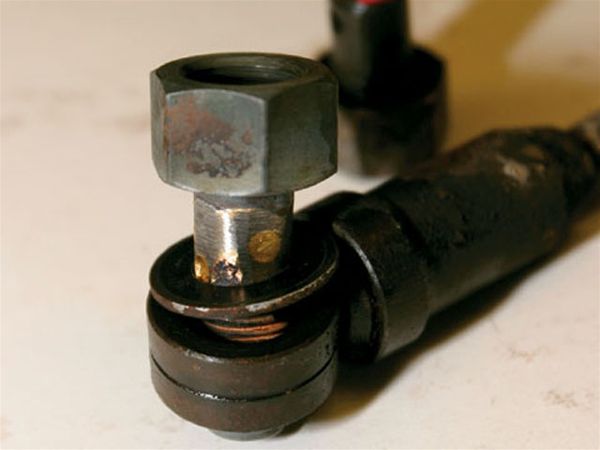 5. Wood recommends a simple solution to prevent this problem from killing your Super Duty transmission; braze up the small holes in the banjo bolt as seen here. He cautioned us that this procedure must be executed without restricting the center flow-through of the bolt. By closing off these four holes, the ATF bypass tube is eliminated from the system, ensuring the ATF will always go through the cooling circuit.