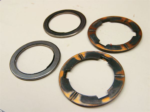 14. Wood replaced each and every high-wear washer (front) with high-quality Torrington bearings (rear). This reduces transmission drag and easily doubles the service life of the parts.