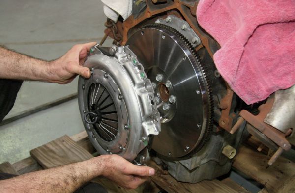 The donor engine was originally connected to an automatic transmission. The flexplate was removed, and a pressure plate and clutch assembly from the Advance Adapters kit was aligned and bolted to the rear of the engine.