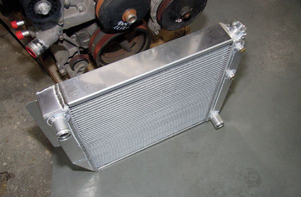 An Advance Adapters aluminum radiator was used that was designed specifically for this conversion, making it an easy bolt-in affair. The stock radiator is not up to the task of cooling the larger V-8 engine, plus all the outlets on this radiator have been placed to work with the GM LS engines.
