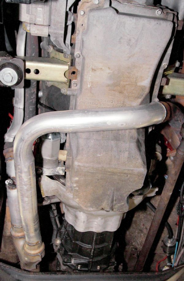 A local muffler shop was called upon to install a new exhaust system. The factory V-8 cast-iron exhaust manifolds were retained as they hug the block well. The driver side pipe was run slightly forward and down under the engine oil pan. The two head pipes meet at a Y-pipe on the passenger side, and a single 21⁄2-inch exhaust runs to a single Flowmaster 50 Series muffler and out the tail of the Wrangler.