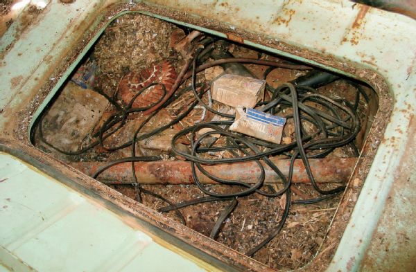 Old projects normally come with a bunch of spare parts. Ours was no exception. The seller even threw in about five pounds of rat turds, some duct tape, and electrical cords. We half expected to find a decomposed body in the back, but other than a dead rat carcass, most of the horror was of the mechanical variety.