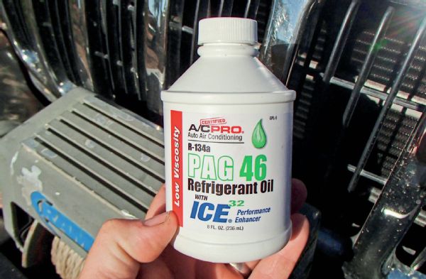 The first step when working on your Jeep’s A/C system is to have the refrigerant from the system recovered or removed. You’ll need to take your Jeep to a shop to have this done properly using a machine that captures the r134A. This was not necessary for us since our system had voluntarily evacuated itself that hot summer day several months ago. This meant we could start tearing out the components we were going to replace. We pulled the grille, winch, bumper, and upper radiator support. If you are a decent shade-tree mechanic and you don’t want to deal with any of the chemicals you can probably get a local shop to recover your r134A, and then once the repairs have been made get them to vacuum and refill the system. However, you will have to add PAG oil to the system when replacing certain parts. Be sure to avoid PAG oil with any A/C system leak sealer mixed in. That stuff generally only helps to clog up the inner workings of your A/C system and rarely, if ever, actually seals a leak.