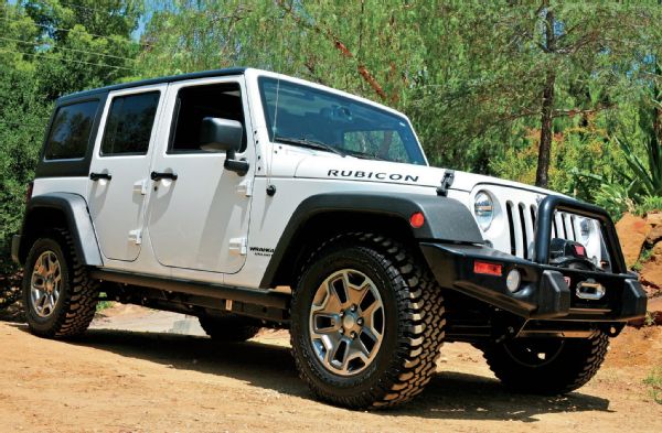 Starting with a well-equipped four-door JK Rubicon, there wasn’t much else that needed to be done. A dealer had already added an ARB bumper and Warn winch, and stock 4:1 transfer case gears and 4.10:1 axle gears gave a great crawl ratio. Selectable lockers front and rear, along with a disconnecting sway bar, also help out tremendously in the dirt. Without getting too radical, just about the only things left to do was to add larger mud-terrains and give this JK a few more inches of height. With the kit at the house, we quickly knocked out the first of a three-day project. With two friends, three of us tore down the front end in a matter of minutes, in the dirt, with a floor jack and a couple jackstands.