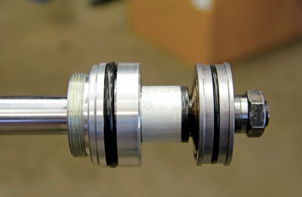 The 2.5 King coilover shock houses the valve piston you see here and a floating piston that resides in the fluid reservoir. To keep debris from entering the shock, King equips the shock with a dust cap, wiper seal, and Teflon-coated brass wear band, which extends the life of the shock, as well as deters leaks.