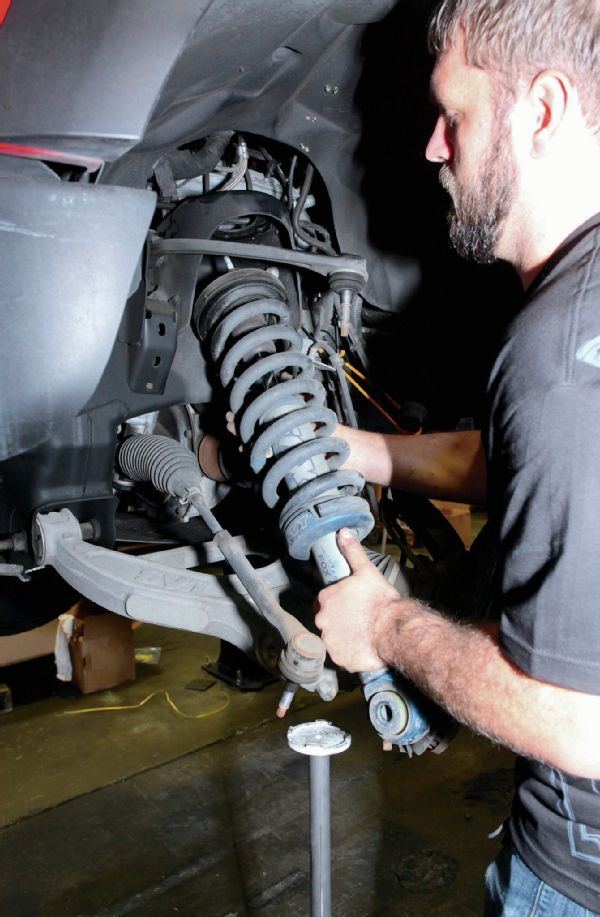 The first steps in this install is to remove the spindle and pull the shocks out.