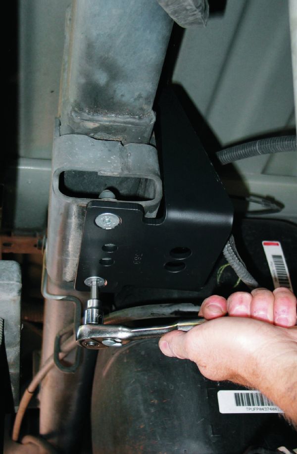 The upper bracket bolts to the bumpstop mounts using flush-mount, self-centering tapered bolts.