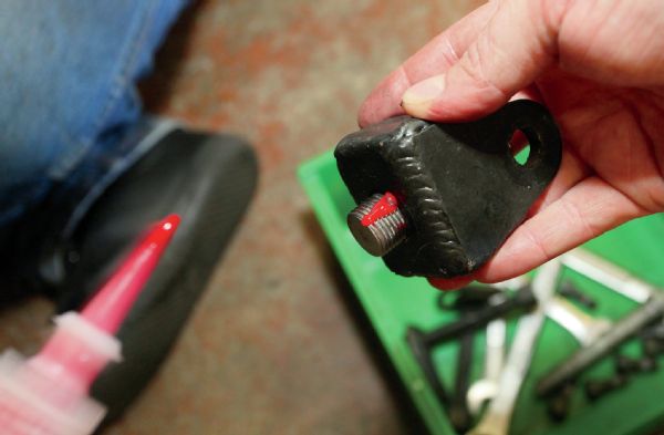A healthy application of Loctite is applied to the bolt that holds the Clevis in place.