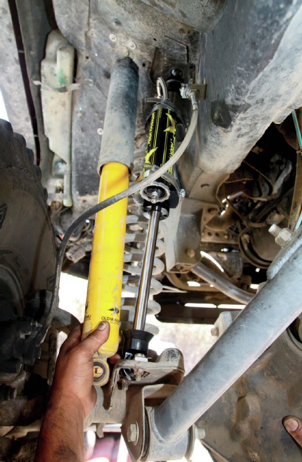 Up front, the old Old Man Emu shocks weren’t in that bad of a shape. They held up well to basically controlling the bounce of the Jeep all on their own for over two years, but that abuse still took its toll. Using the lengths we provided, the Rock Krawler shocks bolted right in with little fuss, and the Jeeps R Us crew took, maybe, 30 minutes to get both front shocks swapped out.