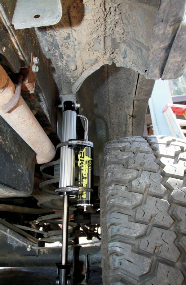 Like we said, it is a unique setup with the rear coil conversion. Rock Krawler had never built shocks for this application before, and as-delivered, the reservoirs were just too close to the tire for our liking. However, the Jeeps R Us crew figured it out in short order. The way the top bushing and reservoir line are oriented, by switching the shocks from side to side and then rotating the reservoirs so they sat behind the shocks, it all fit great. We’ve been in contact with Rock Krawler, and they know what we did, so future shocks coming out of the shop will already be set right for this application.