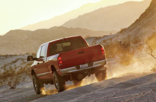 Dodge Ram Driving Down Dirt Road Photo 81243012