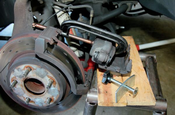 Compressing Brake Caliper Photo 71625248