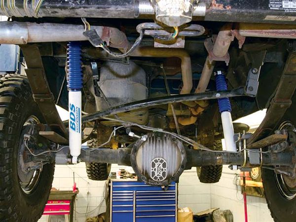 The rear suspension is lifted via a spring-over-axle (SOA) conversion. The major components of the SOA conversion include new spring-perch brackets that double as shock mounts, spring plates, and U-bolts, a track-bar drop bracket, a brake-line drop bracket, and new shocks.