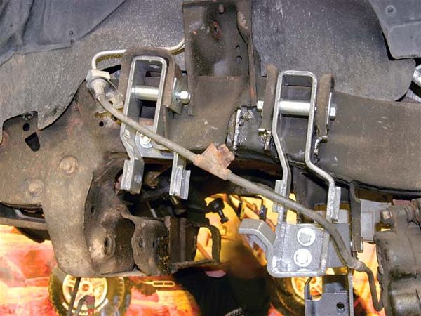 These are the front and rear upper A-arm drop brackets. As their name implies, they drop the upper A-arms, thus creating lift. They are made from 1/4-inch steel. Look closely and you can see where items like the OE extended-stop support wing and part of the upper control arm pocket were removed using a plasma cutter. All total, there are approximately six OE items that need to be removed or modified to make room for the new suspension components.