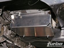 Turp_0812_18_z+mitsubishi_evo_ams_fuel_surge_tank+skid_plate_positioning