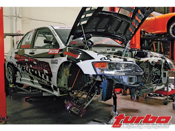 Turp_0811_01_z+mitsubishi_lancer_evo_9_evasive_motorsports+front_right_side_view