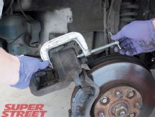 130_0704_07_z+brake_pad_installation_guide+compress_brake_pistons_with_c_clamp