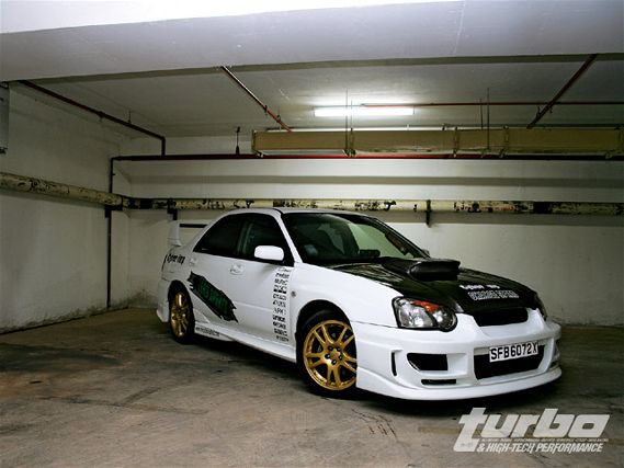 Turp_0812_02_z+subaru_wrx_sti_buyers_guide+front_right_view